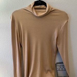 Naked light brown tan nude turtleneck sweater